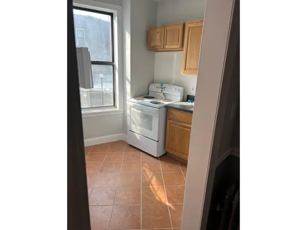 a room with a sink and a washing machine