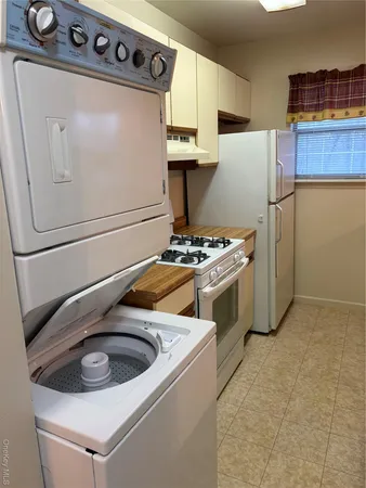 a kitchen with a stove and a refrigerator