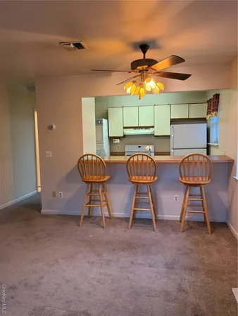 a view of a room with gym equipment and windows