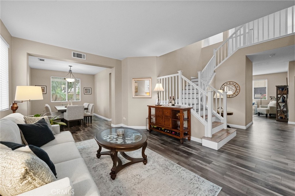 7220 Cumberland Place Rancho Cucamonga, CA 91739 - Photo 5 of 41 Elegant entry showcasing the open staircase and seamless flow into the living space.