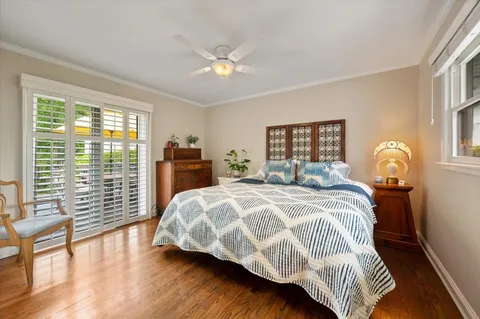 a bedroom with a large bed and a large window