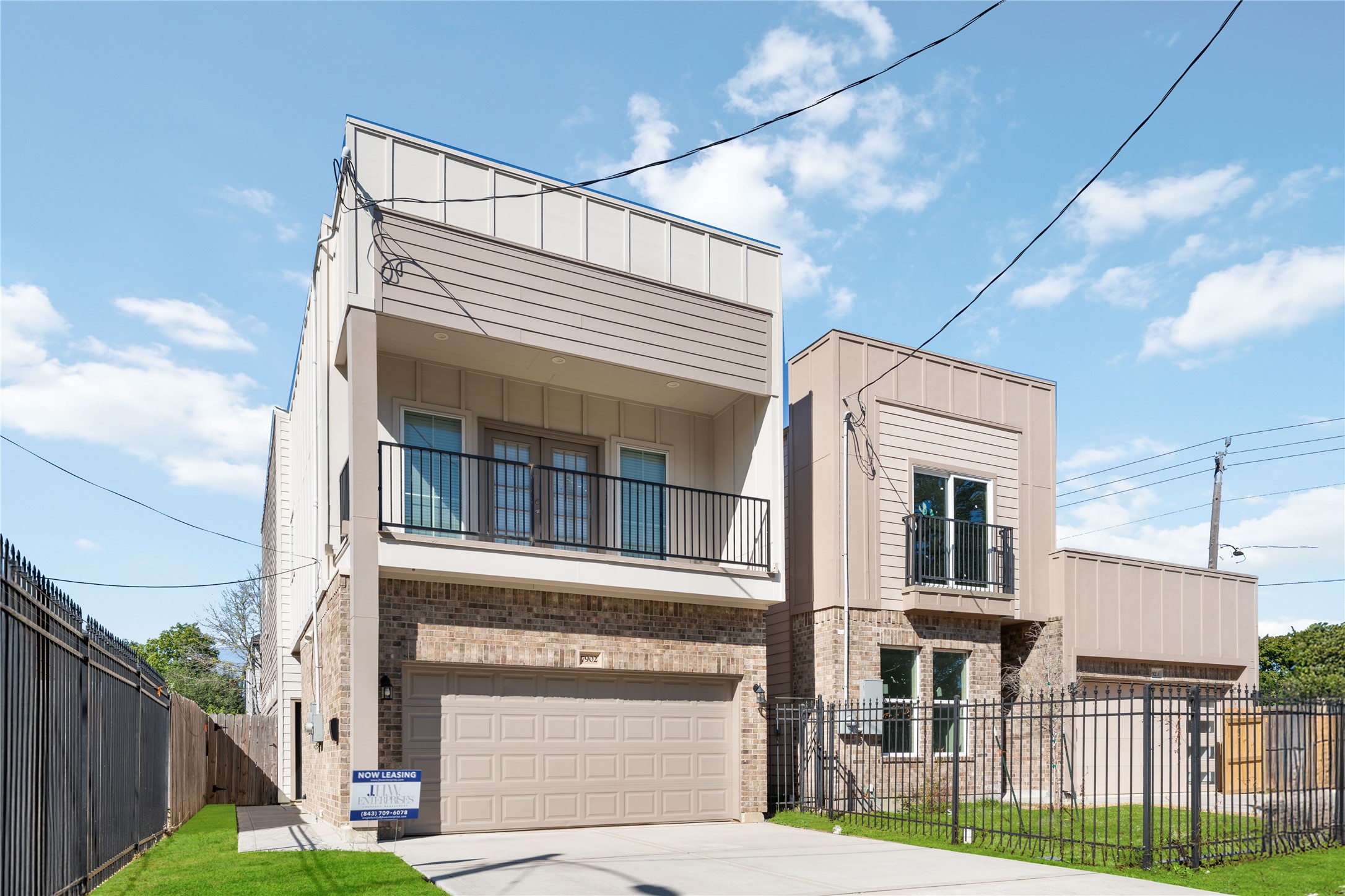 7902 Parnell Street, Unit B Houston, TX 77051 - Photo 2 of 13 a front view of a house with a yard and garage