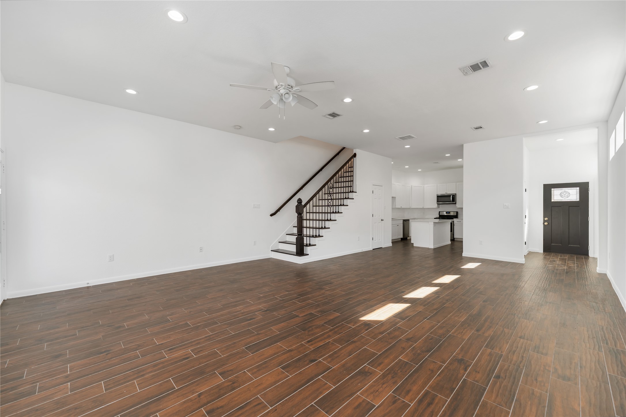 7902 Parnell Street, Unit B Houston, TX 77051 - Photo 4 of 13 a view of an empty room with wooden floor