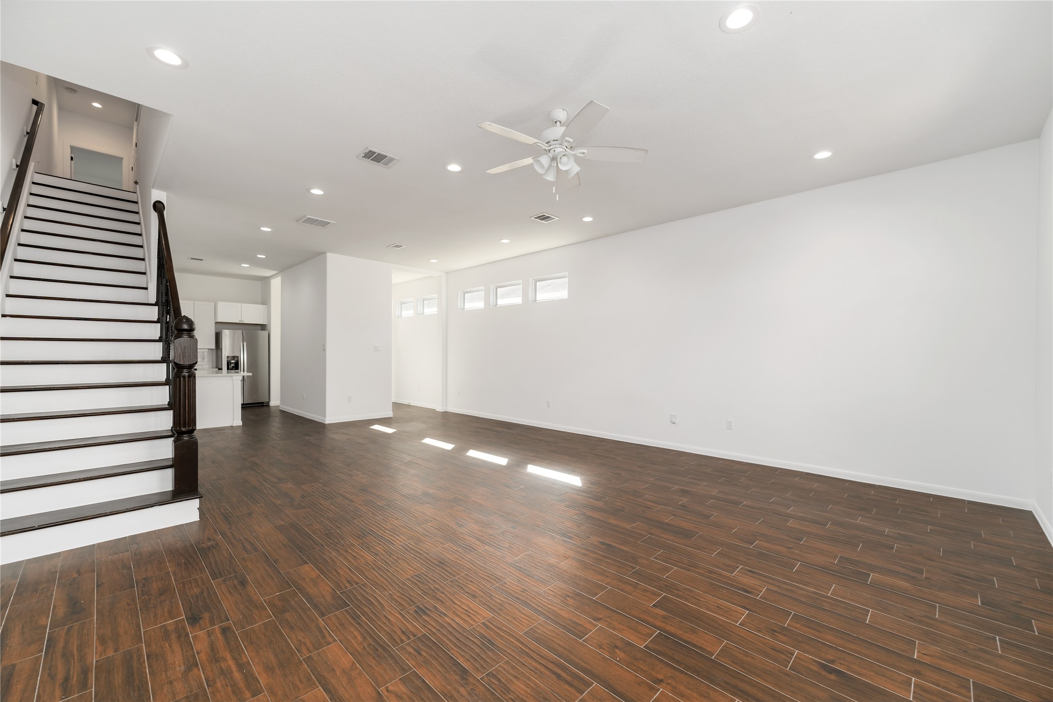 7902 Parnell Street, Unit B Houston, TX 77051 - Photo 5 of 13 a view of a room with wooden floors and stairs