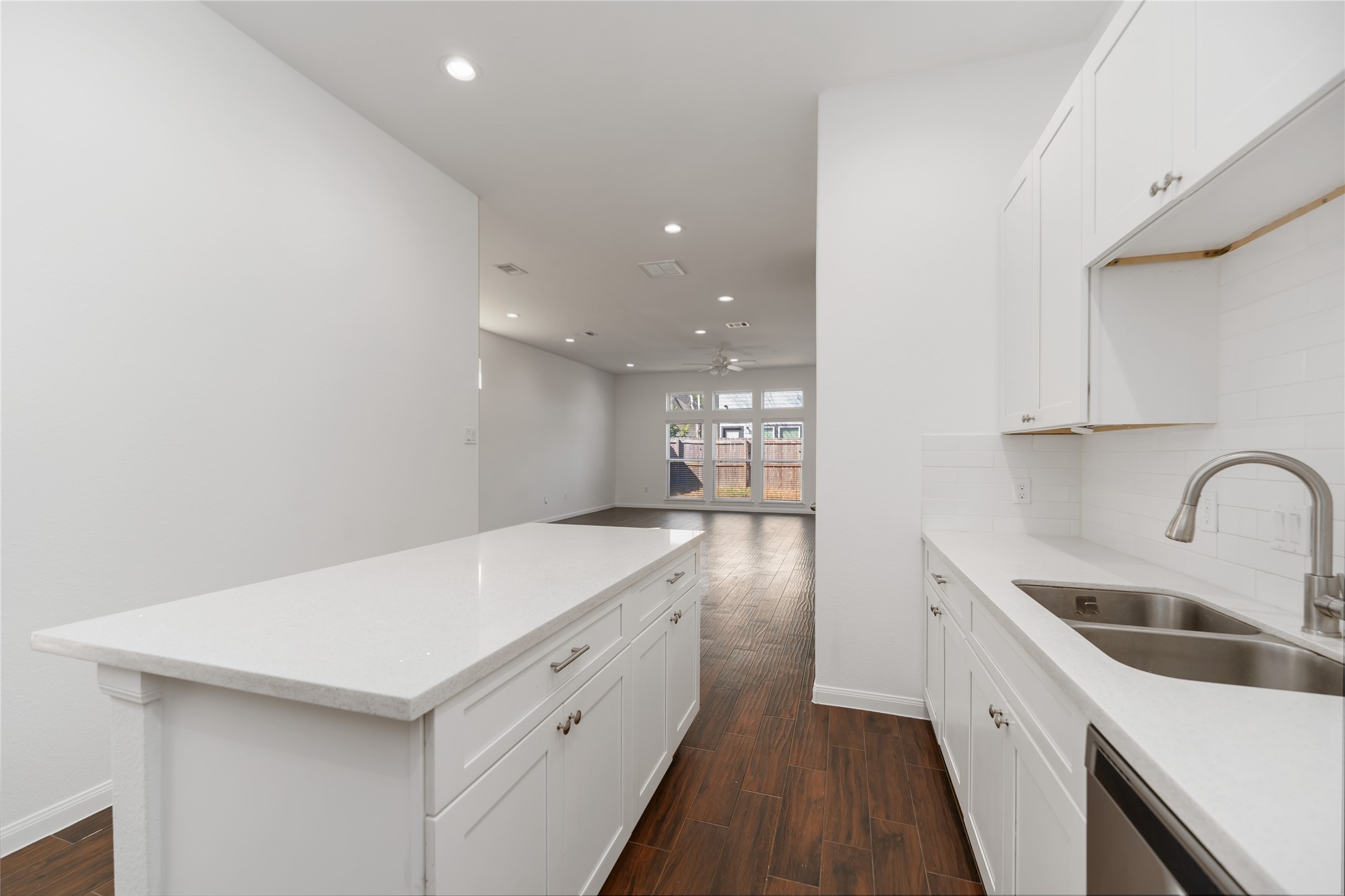 7902 Parnell Street, Unit B Houston, TX 77051 - Photo 10 of 13 a kitchen with a sink a stove and cabinets