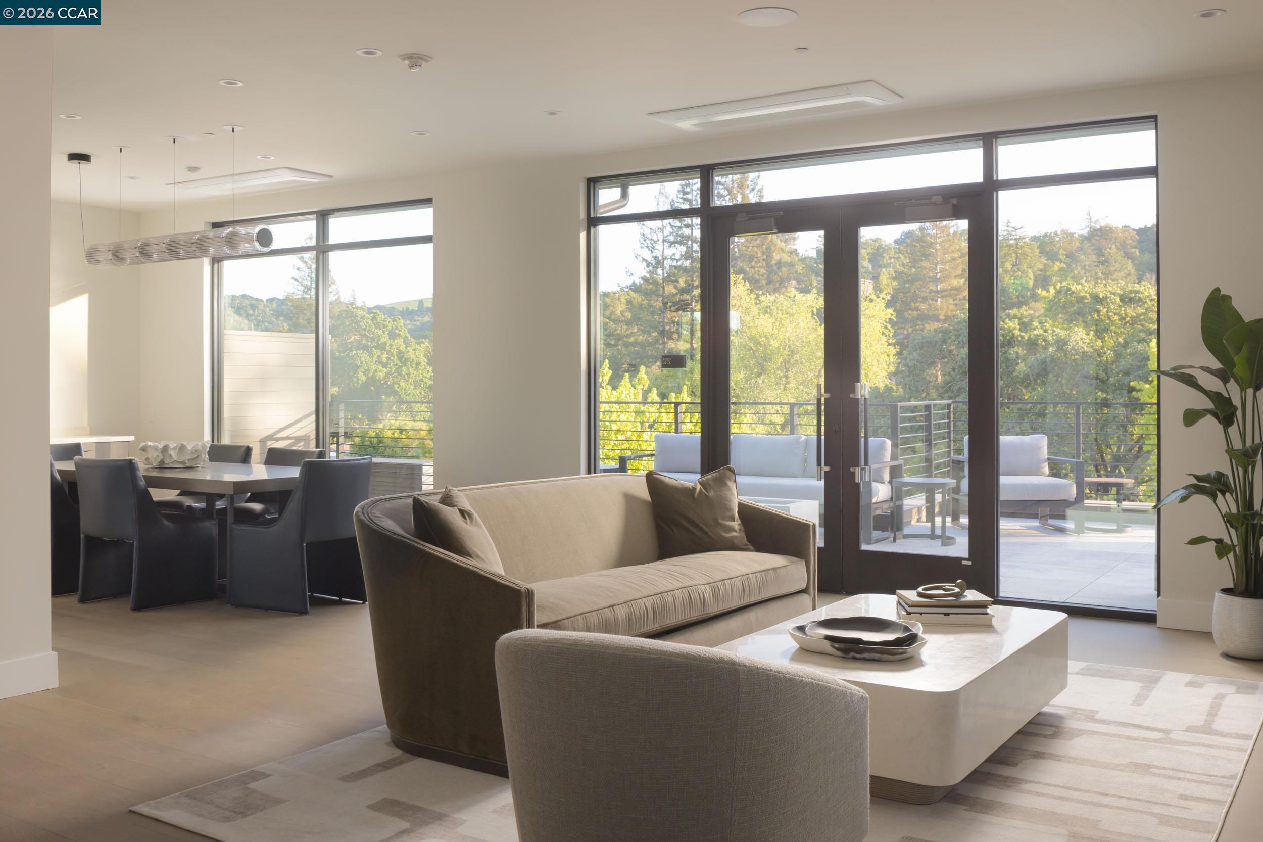 950 Hough Avenue, Unit 202 Lafayette, CA 94549 - Photo 25 of 38 a living room with furniture and a floor to ceiling window