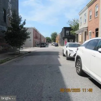 a front view of a building with grey walls