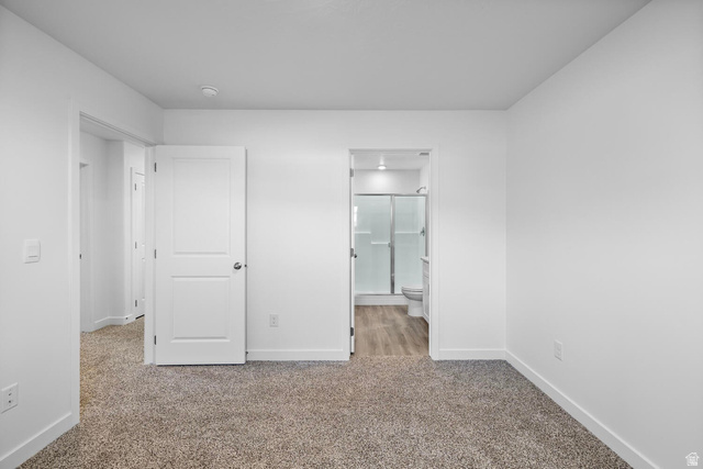 1597 South Fins Road, Unit 4177 Washington, UT 84780 - Photo 15 of 33 Carpeted room featuring a white interior door with paneling, crisp white walls, and bright overhead lighting
