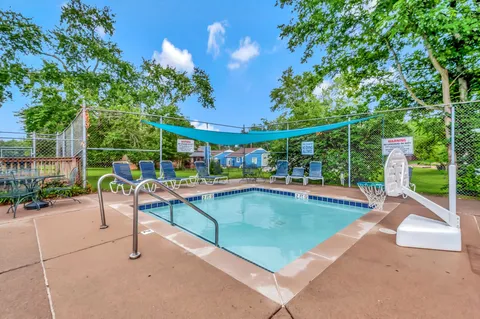 a view of a swimming pool with a patio