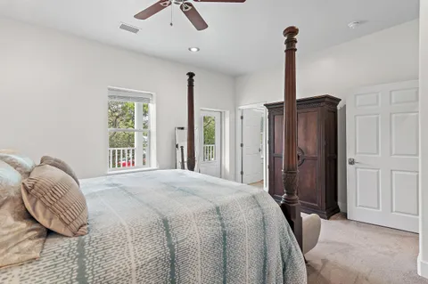 a bedroom with a bed closet and window