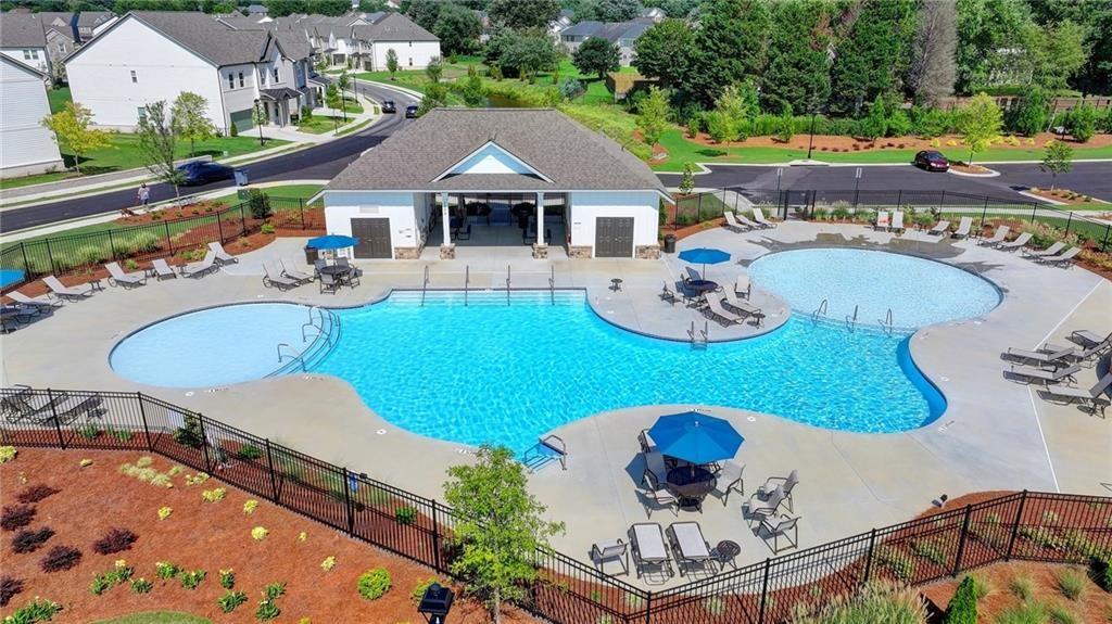 4078 Haleston Road Duluth, GA 30097 - Photo 23 of 25 a balcony with table and chairs