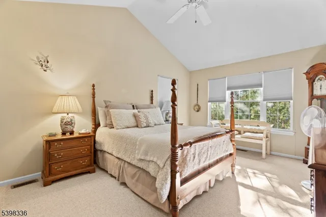 a bed room with a bed and a window