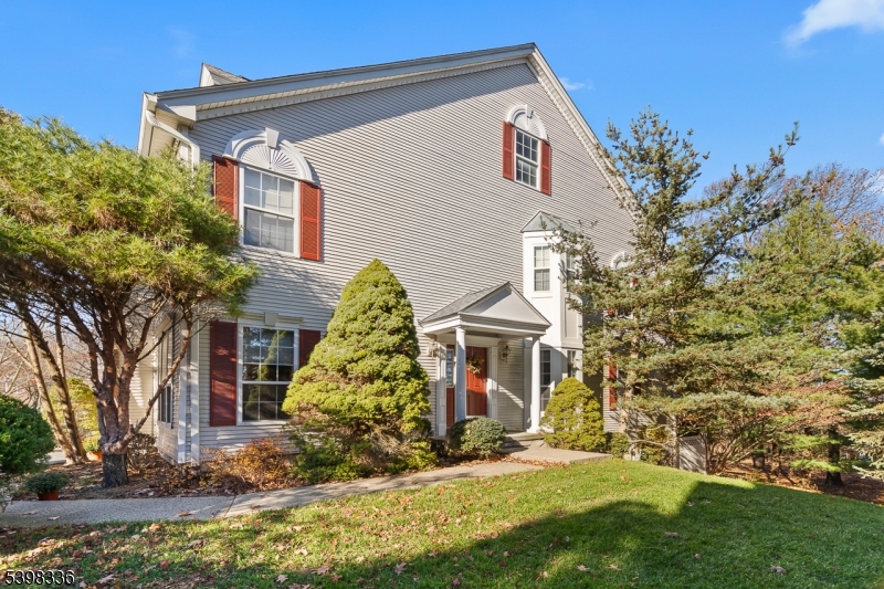14 Minuteman Court Bernards, NJ 07920 - Photo 2 of 34 a front view of a house with a garden