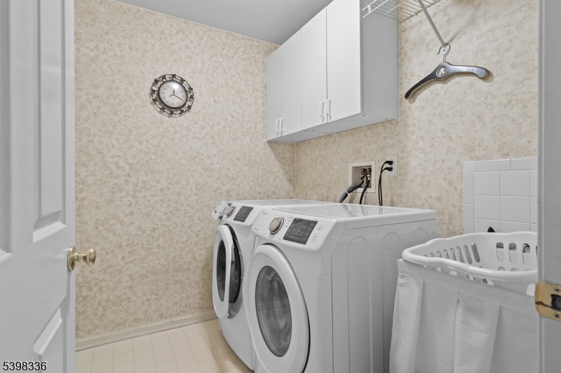 14 Minuteman Court Bernards, NJ 07920 - Photo 25 of 34 a utility room with dryer and washer