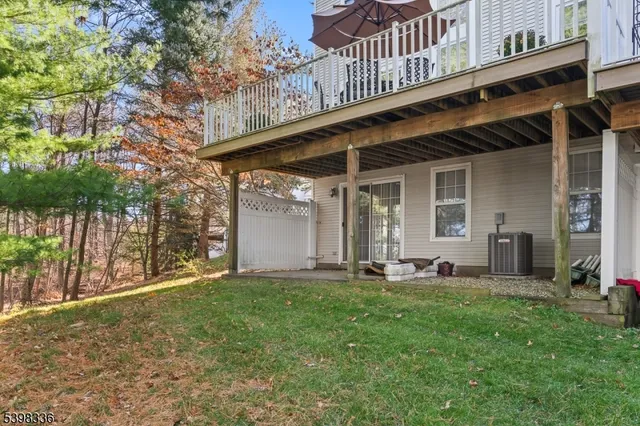 a view of a chair and table in backyard