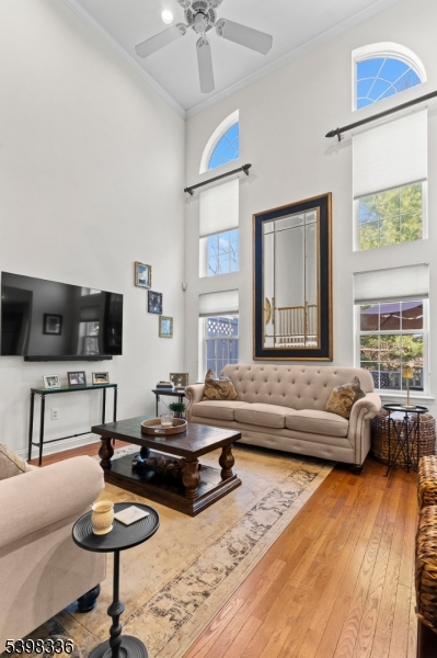 14 Minuteman Court Bernards, NJ 07920 - Photo 6 of 34 a living room with furniture and a flat screen tv