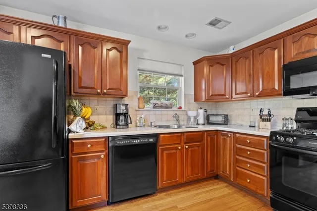 a kitchen with a sink stove and refrigerator