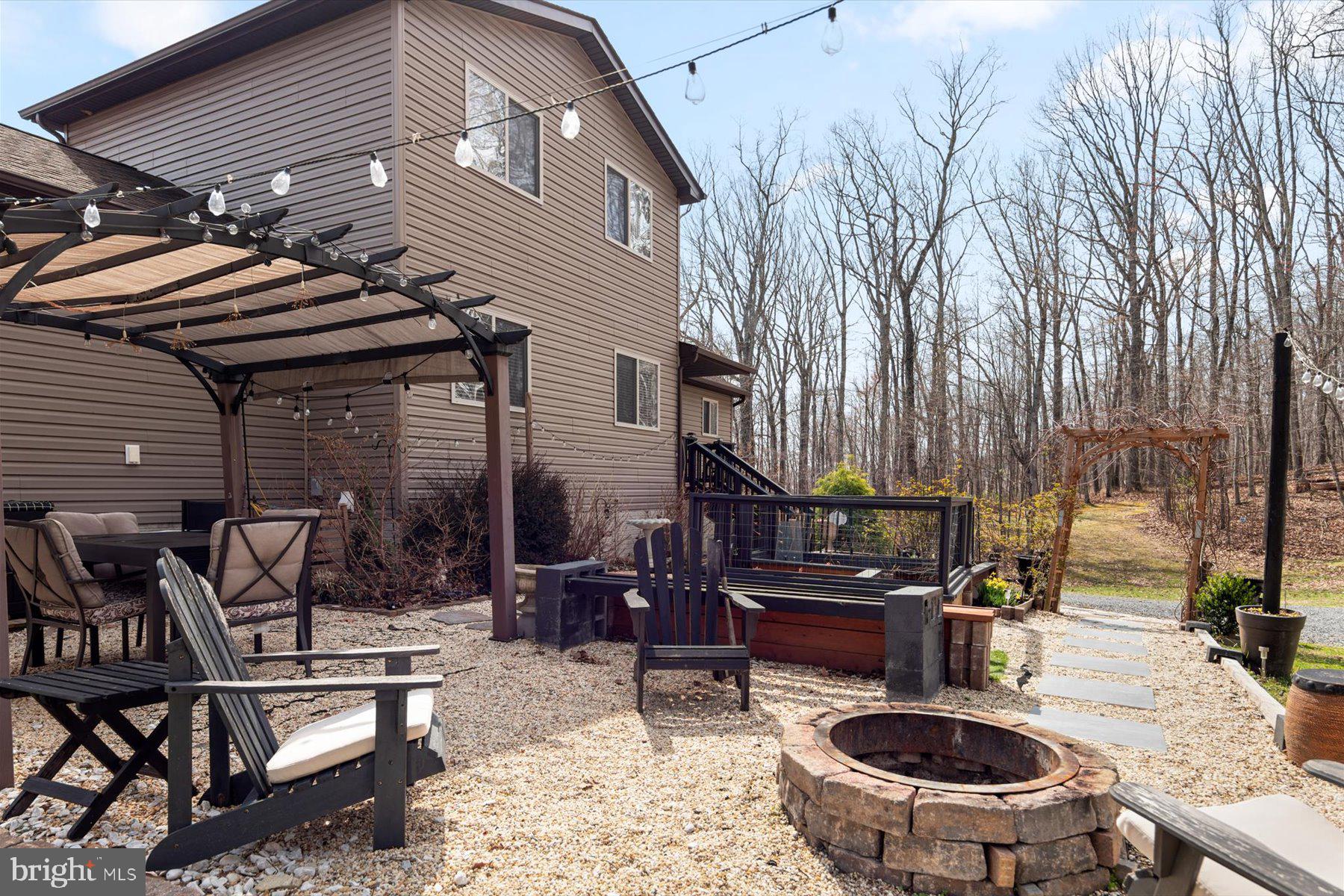 6246 John Barton Payne Road Marshall, VA 20115 - Photo 30 of 32 a view of a patio with table and chairs and potted plants