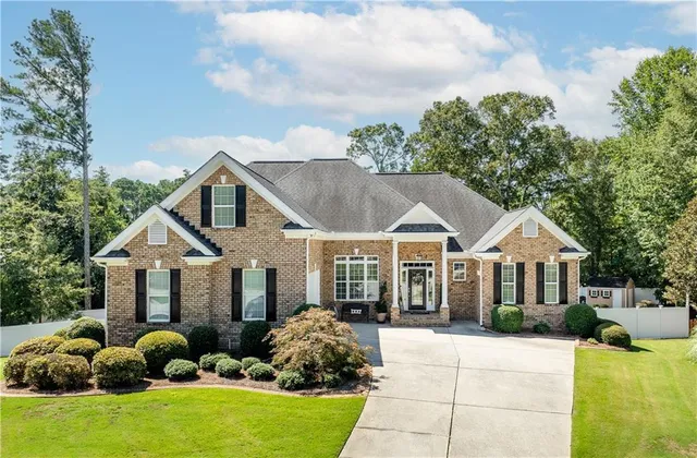 a front view of a house with garden