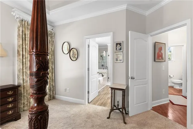 a view of an entryway with wooden floor and a livingroom view