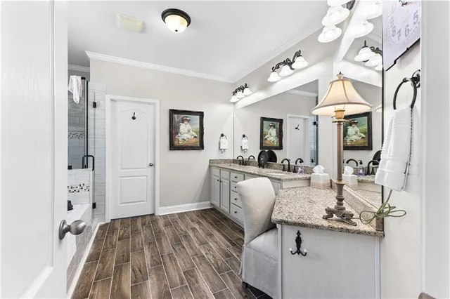 a living room with kitchen island granite countertop furniture and a chandelier