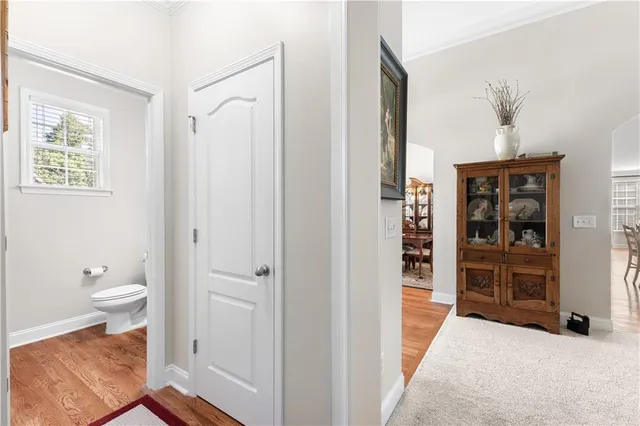 a bathroom with a granite countertop sink a toilet a tub and shower