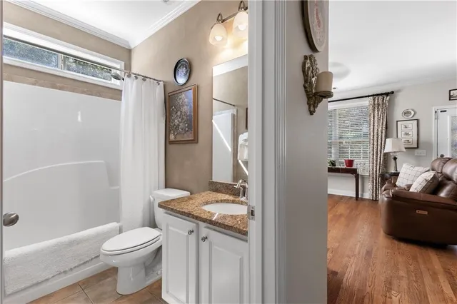 a view of kitchen with furniture and wooden floor
