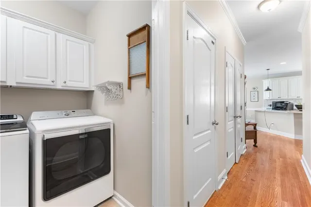 a view of a workspace with furniture and wooden floor