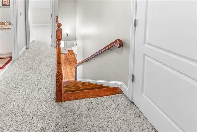 a view of hallway with wooden floor