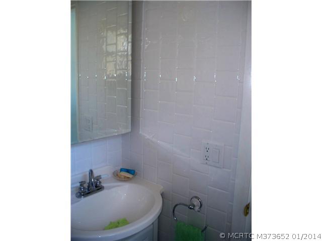 1919 Southwest Palm City Road, Unit 10J Stuart, FL 34994 - Photo 12 of 25 Master Bath/Spa. Pictures do not do justice. The tile on the walls go to the ceiling, updated sink/vanity/medicine cabinet and fixtures
