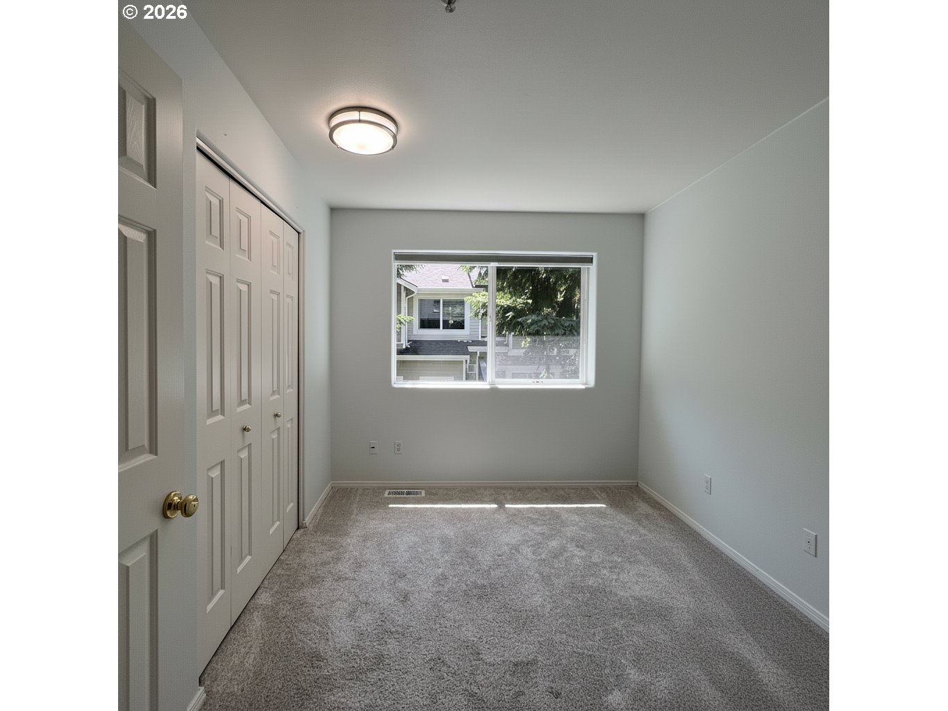 14110 Southwest Barrows Road, Unit 1 Portland, OR 97223 - Photo 13 of 18 a view of an empty room with windows and closet