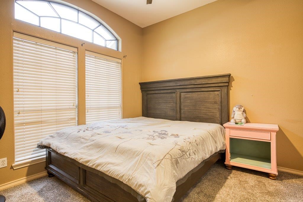 314 Hancock Odem, TX 78370 - Photo 19 of 40 a bedroom with a bed and a window