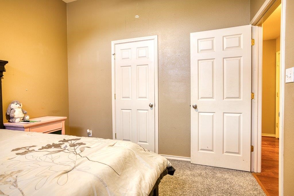 314 Hancock Odem, TX 78370 - Photo 20 of 40 a bedroom with a bed and a window
