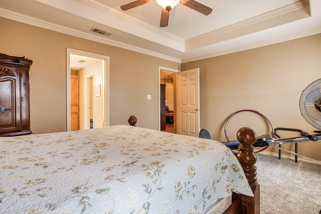 314 Hancock Odem, TX 78370 - Photo 24 of 40 a bedroom with a bed and a dresser