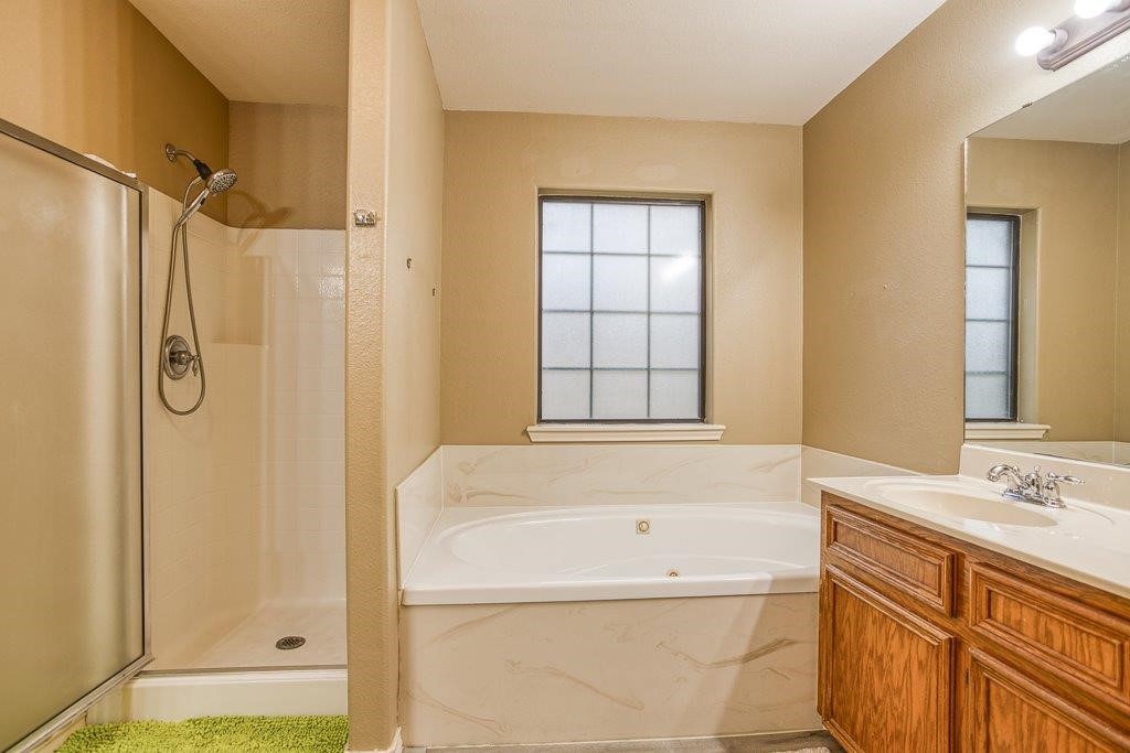 314 Hancock Odem, TX 78370 - Photo 30 of 40 a bathroom with a bathtub and a shower