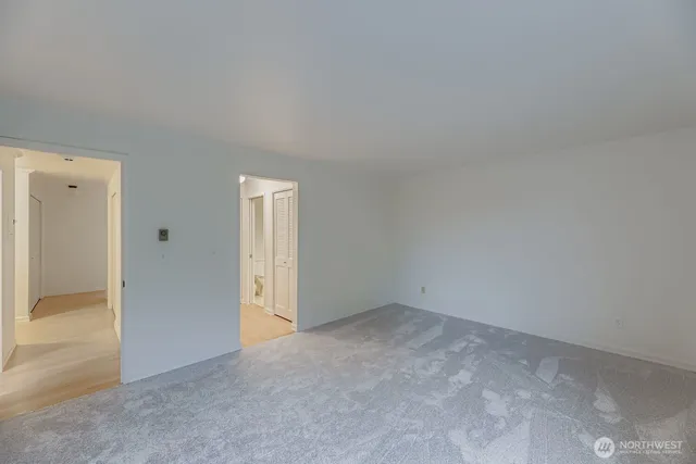 an empty room with closet area