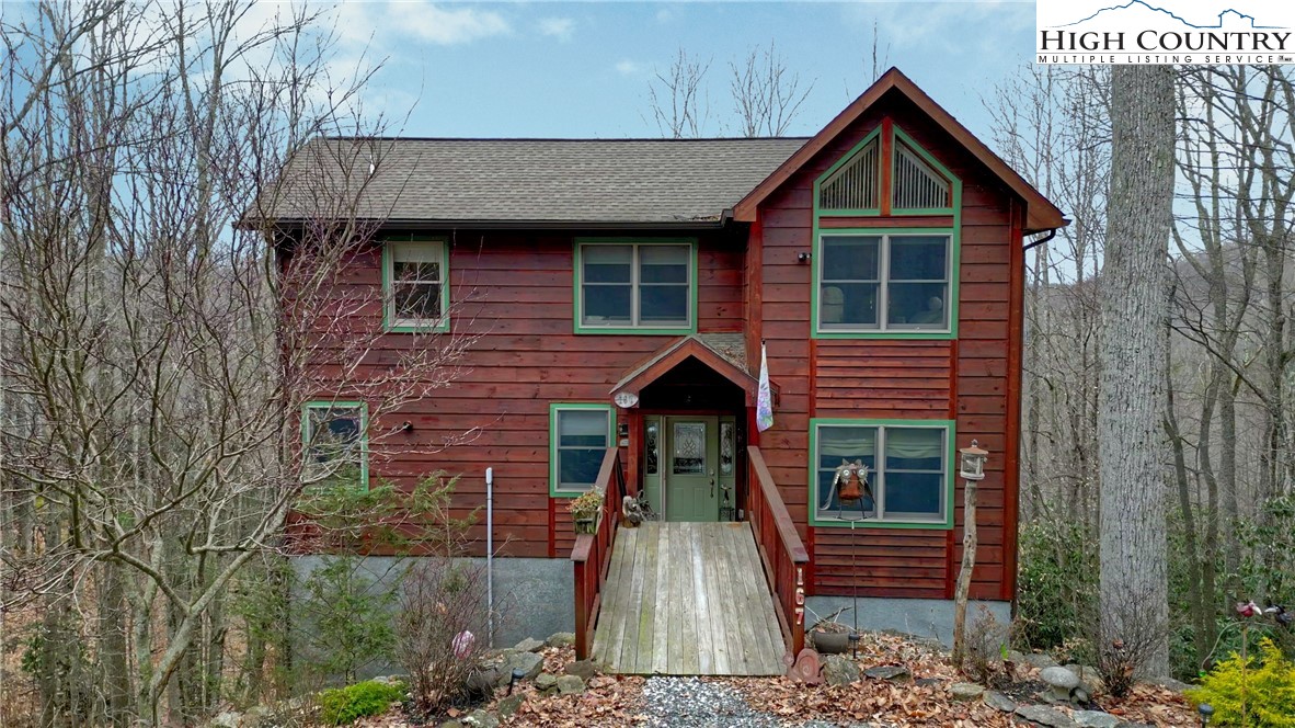167 Rhododendron Drive Beech Mountain, NC 28604 - Photo 1 of 46 a front view of a house with a yard
