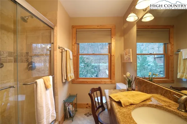 a bed room with a bed and a mirror