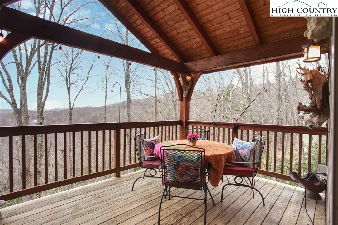 167 Rhododendron Drive Beech Mountain, NC 28604 - Photo 16 of 46 a view of a chairs and table in the balcony