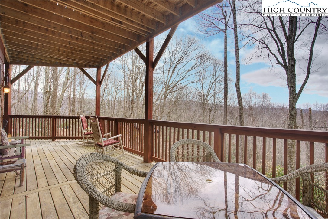 167 Rhododendron Drive Beech Mountain, NC 28604 - Photo 31 of 46 a view of balcony with wooden floor and outdoor seating