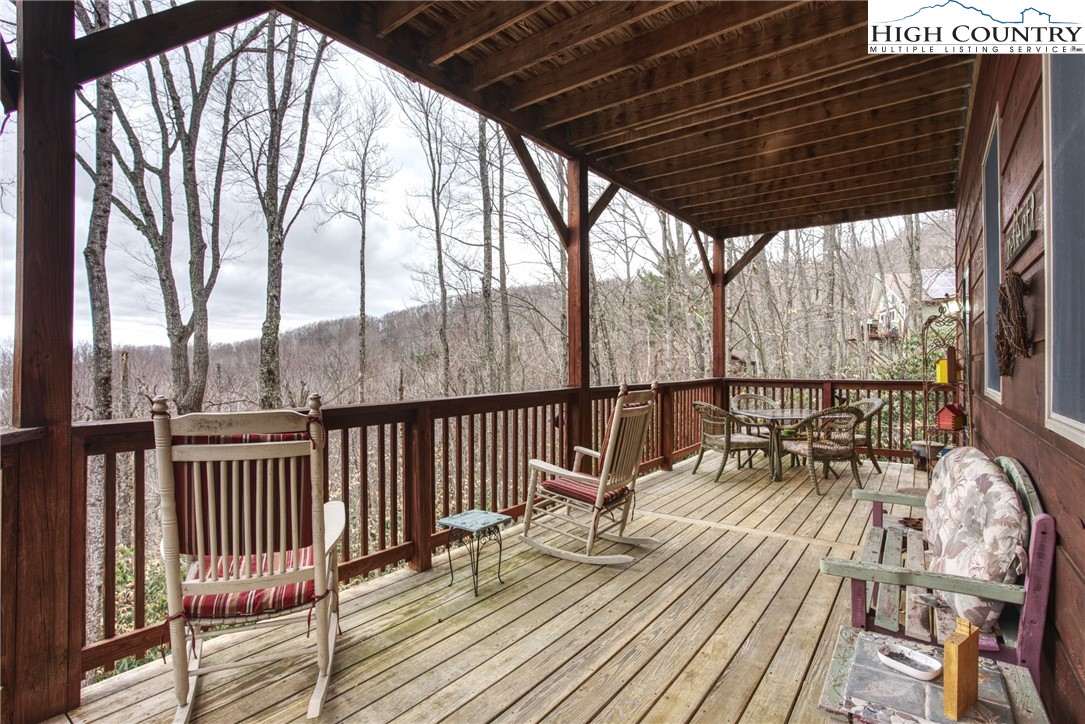 167 Rhododendron Drive Beech Mountain, NC 28604 - Photo 32 of 46 a view of balcony with wooden floor and iron fence