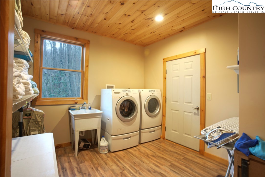 167 Rhododendron Drive Beech Mountain, NC 28604 - Photo 33 of 46 a utility room with dryer and washer