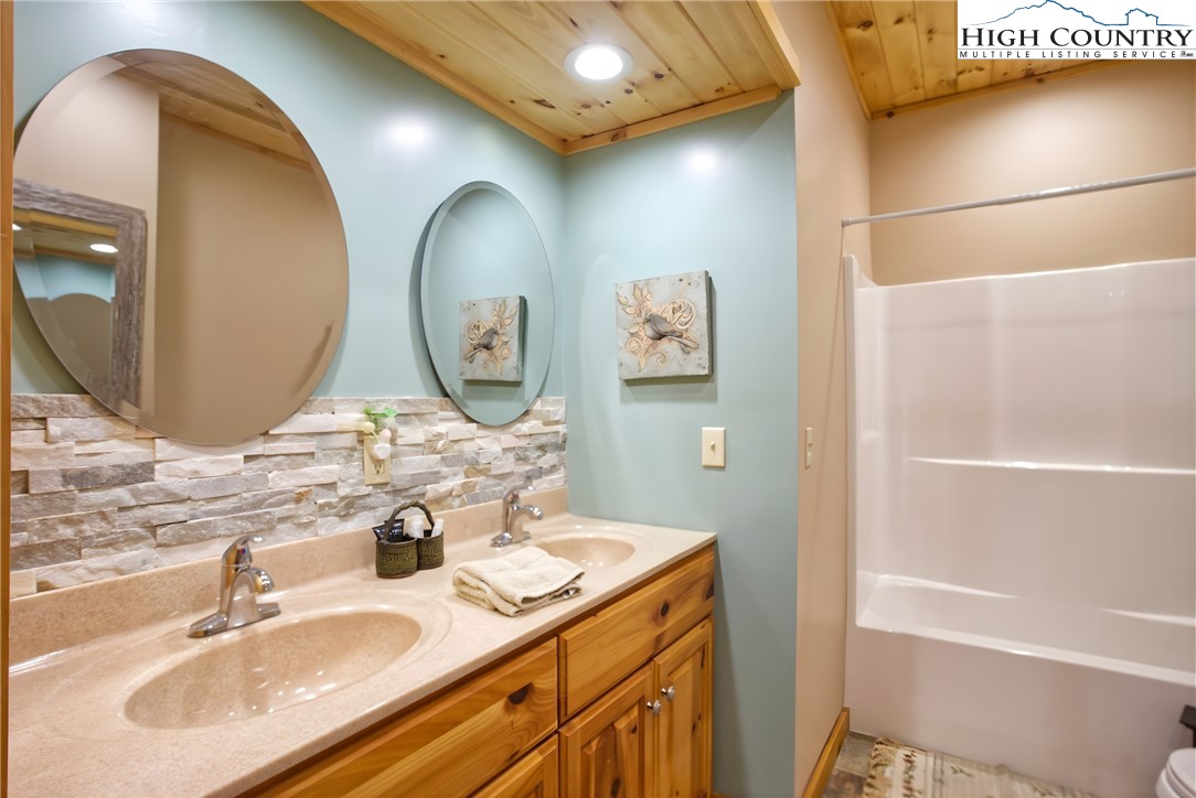 167 Rhododendron Drive Beech Mountain, NC 28604 - Photo 36 of 46 a bathroom with a sink and a mirror