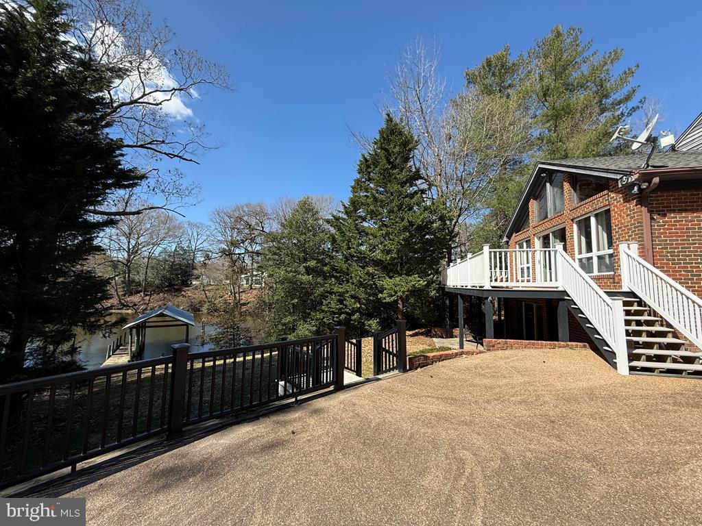 a view of a house with wooden fence