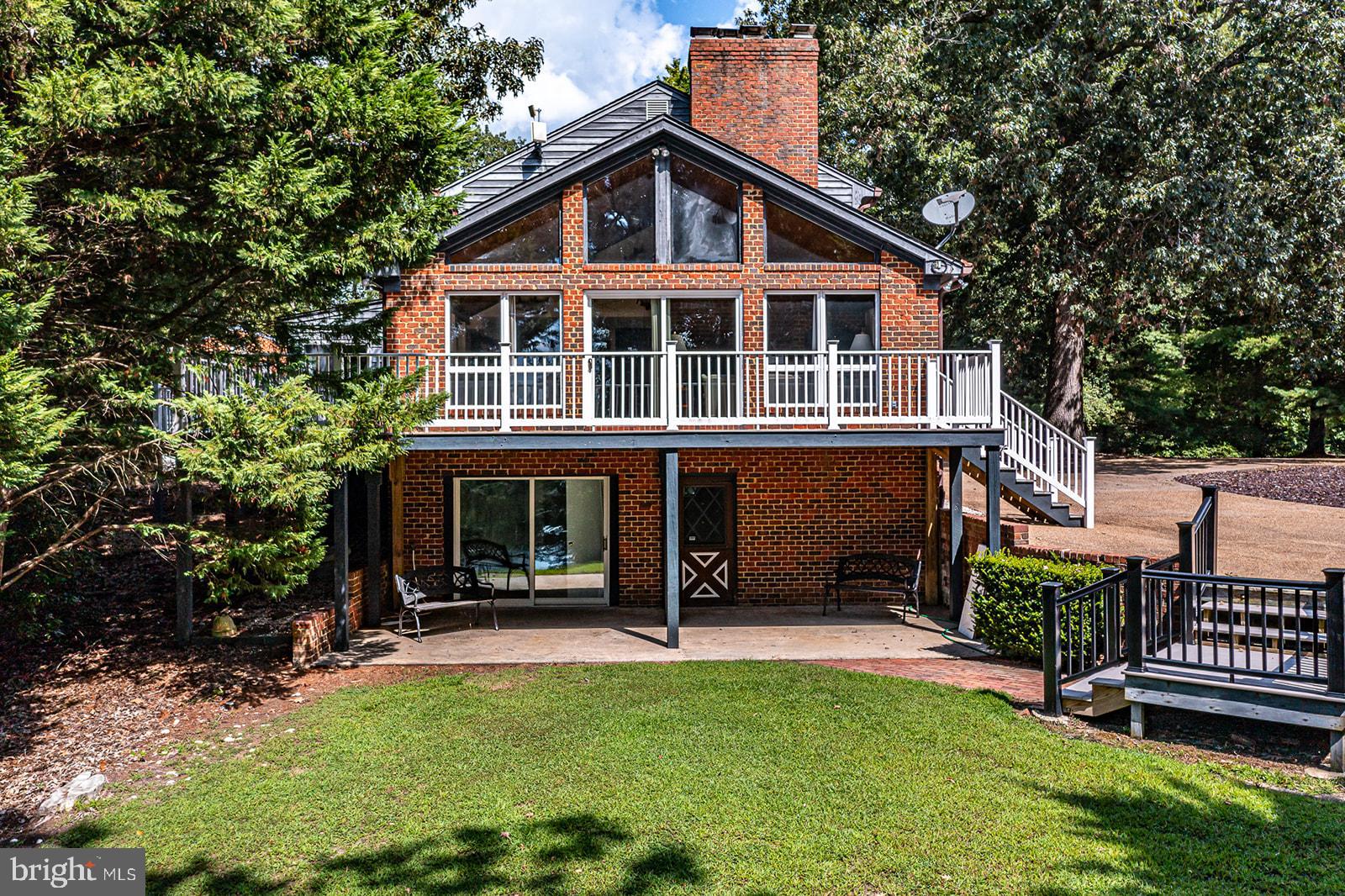 710 Train Lane Heathsville, VA 22473 - Photo 2 of 59 a view of a house with a yard porch and sitting area