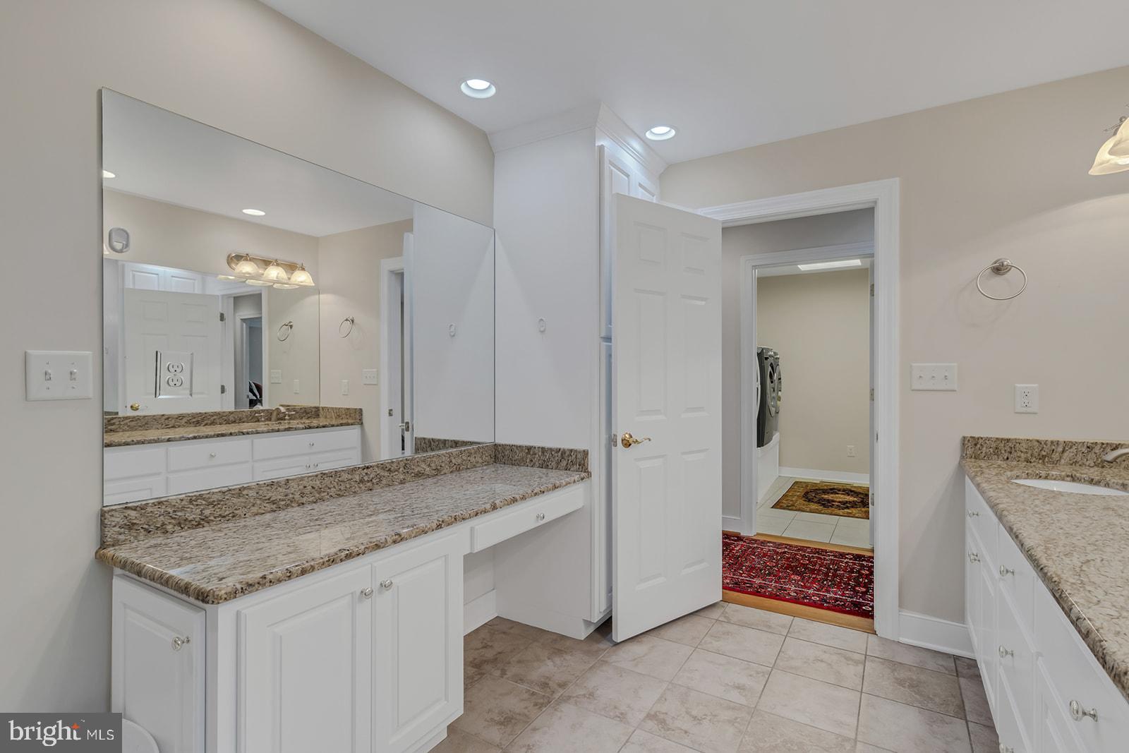 710 Train Lane Heathsville, VA 22473 - Photo 25 of 59 a bathroom with a granite countertop sink and a mirror