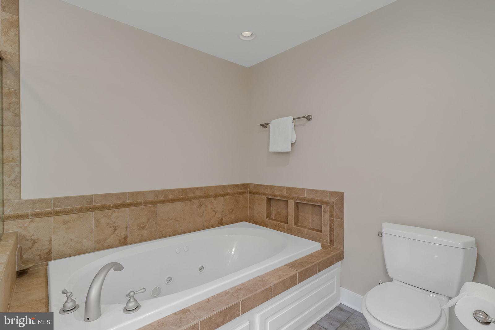 710 Train Lane Heathsville, VA 22473 - Photo 26 of 59 a bathroom with a bathtub and toilet