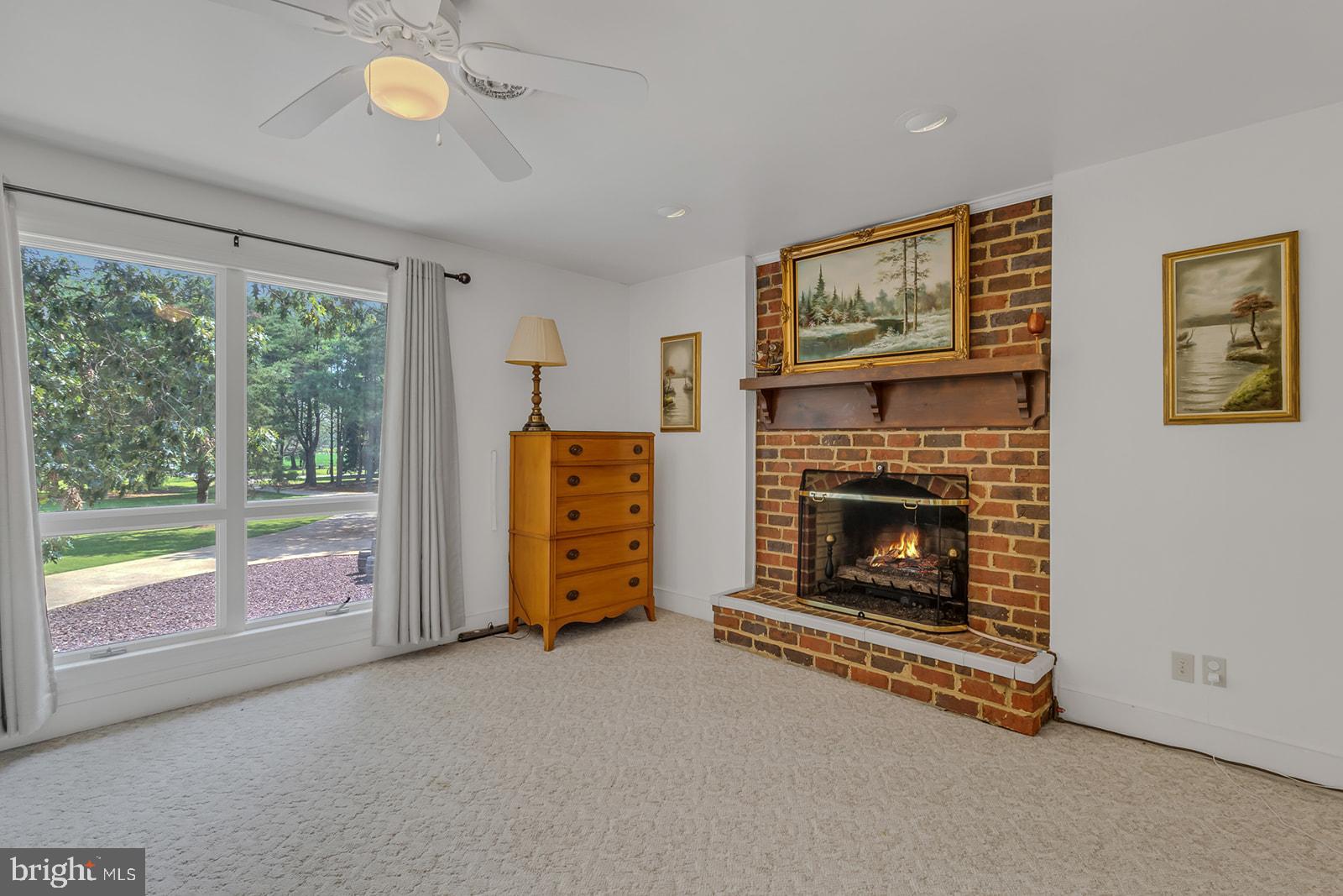 710 Train Lane Heathsville, VA 22473 - Photo 38 of 59 a living room with furniture and a fireplace