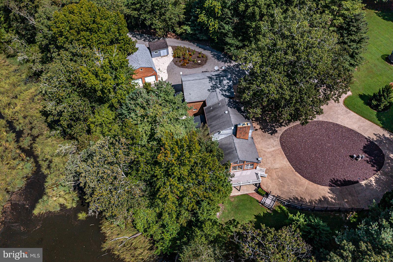 710 Train Lane Heathsville, VA 22473 - Photo 50 of 59 an aerial view of a house with garden space and a street view