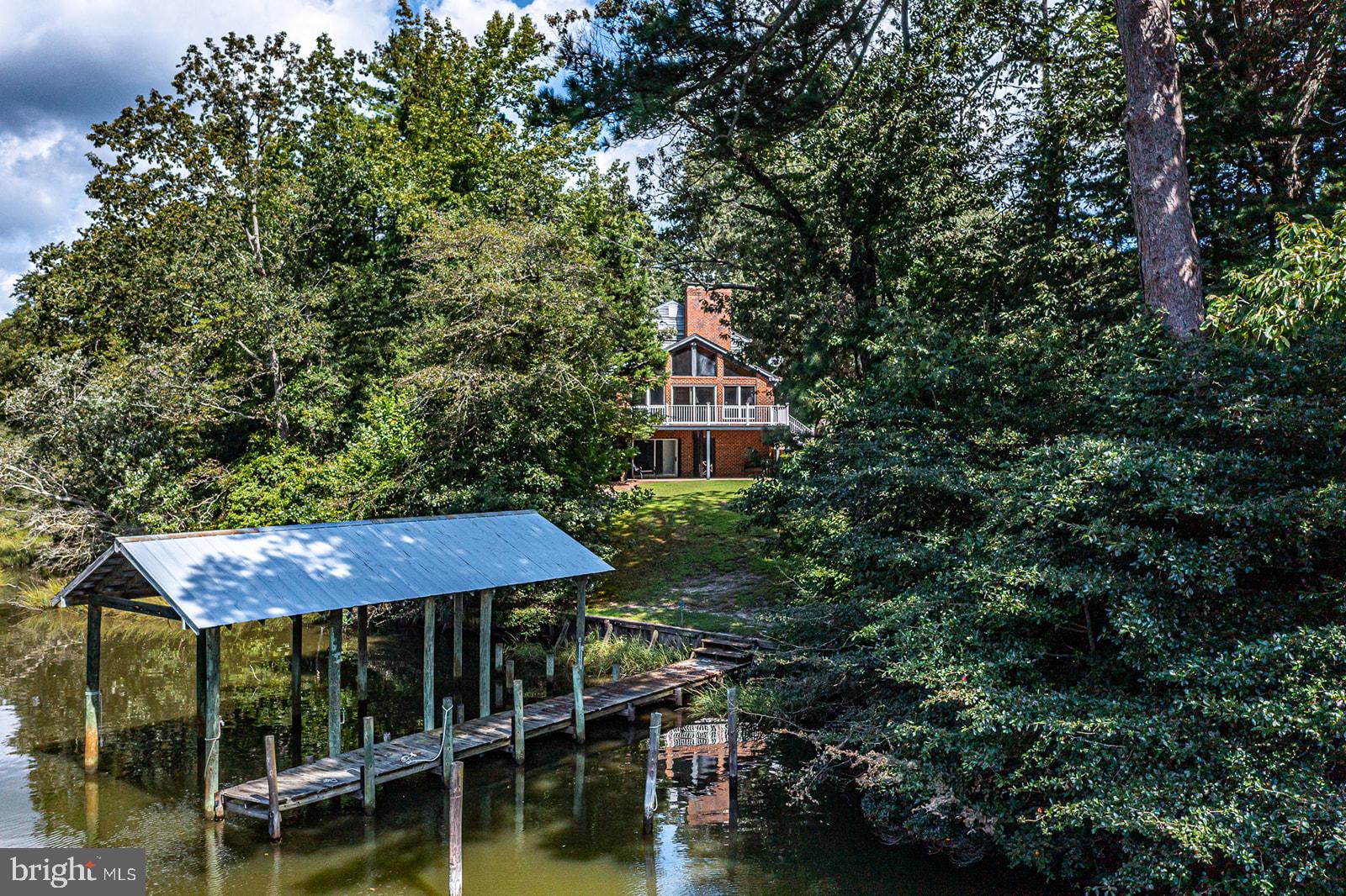 710 Train Lane Heathsville, VA 22473 - Photo 5 of 59 a front view of a house with a yard and balcony